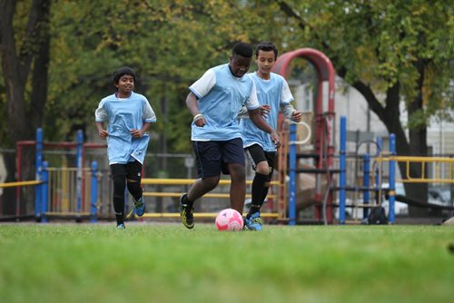 Hermon D'sooza (left), Bernard Manishimwe (centre), and Sangam Sanyasi, all part of the IRCOM under 13  soccer team, practice on the field at Victoria Albert school yard  Thursday.  The U13 inner-city team has made the citywide A-side finals.    See Carol Sanders story.   Sept 24, 2015 Ruth Bonneville / Winnipeg Free Press