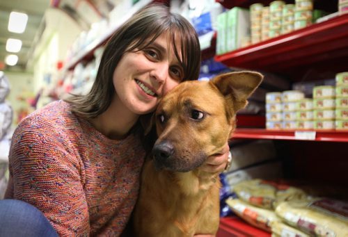 Catarina Pereira is a dog volunteer at D'arcy's ARC.   She poses with one of her favourite dogs in the store that she loves walking regularly.   Sept 24, 2015 Ruth Bonneville / Winnipeg Free Press