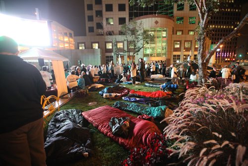 Approximately 100 heads of companies and community leaders prepare to sleep outside overnight at Portage and Main Thursday evening for the 5th annual CEO Sleepout to help raise funds and awareness of people who are homeless.  Sept 24, 2015 Ruth Bonneville / Winnipeg Free Press