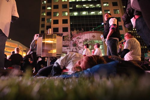 Approximately 100 heads of companies and community leaders prepare to sleep outside overnight at Portage and Main Thursday evening for the 5th annual CEO Sleepout to help raise funds and awareness of people who are homeless.  Sept 24, 2015 Ruth Bonneville / Winnipeg Free Press