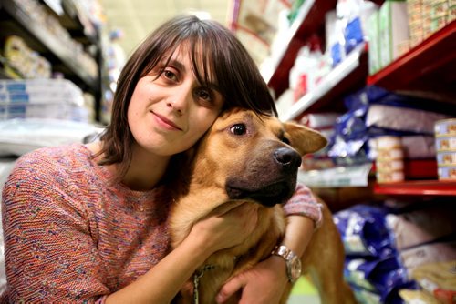 Catarina Pereira is a dog volunteer at D'arcy's ARC.   She poses with one of her favourite dogs in the store that she loves walking regularly.    Sept 24, 2015 Ruth Bonneville / Winnipeg Free Press