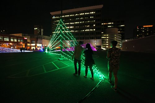 People check out  Art Installation #5 in the Parking Lot On Graham Ave. Between Carlton St. and Hargrave St. titled -   C'est quoin le point by Lights Unlimited, Saturday night during the Nuit Blanche art festival.    Standup Photo  Sept 26, 2015 Ruth Bonneville / Winnipeg Free Press
