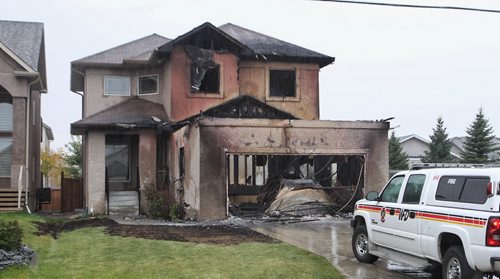 A house destroyed by an early morning fire in the 900 block of John Bruce Road East.  150927 September 27, 2015 MIKE DEAL / WINNIPEG FREE PRESS