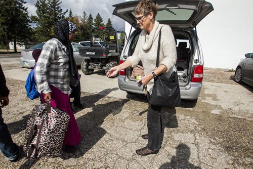 Karin Gordon loads up her van after arriving in Emerson, MB to pick up refugees who have made it across the border with the United States. 150927 - Sunday, September 27, 2015 -  MIKE DEAL / WINNIPEG FREE PRESS