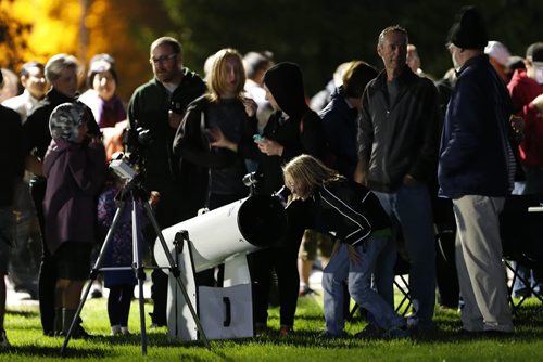 September 27, 2015 - 150927  -  Winnipeggers come out to view the eclipse of the moon at Assiniboine Park Sunday, September 27, 2015.  John Woods / Winnipeg Free Press