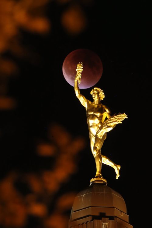 September 27, 2015 - 150927  -  Lunar eclipse behind the Golden Boy at the Manitoba Legislature Sunday, September 27, 2015.  John Woods / Winnipeg Free Press