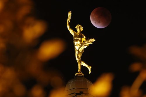 September 27, 2015 - 150927  -  Lunar eclipse on a Superman behind the Golden Boy at the Manitoba Legislature Sunday, September 27, 2015.  John Woods / Winnipeg Free Press