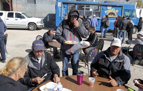 With winter on its way, The Winnipeg Food Truck Alliance thought it would be a great idea to end their season by giving back and serving a delicious meal at Siloam Mission. L-R Wanda Deneve, Brent Gilmore, Rob (no last name given), and Jock Moar. BORIS MINKEVICH / WINNIPEG FREE PRESS  Sept. 28, 2015