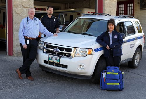 Emergency Program in the Community (EPIC). (L-R) Dr. Robert Grierson, medical director, Winnipeg Fire and Paramedic Service, Ryan Sneath, director of the community paramedic program with WFPS, and Karen Martin, paramedic who works mainly with the community paramedic program. BORIS MINKEVICH / WINNIPEG FREE PRESS  Sept. 28, 2015