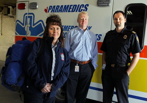 Emergency Program in the Community (EPIC).  Karen Martin, paramedic who works mainly with the community paramedic program, Dr. Robert Grierson, medical director, Winnipeg Fire and Paramedic Service, and Ryan Sneath, director of the community paramedic program with WFPS. BORIS MINKEVICH / WINNIPEG FREE PRESS  Sept. 28, 2015