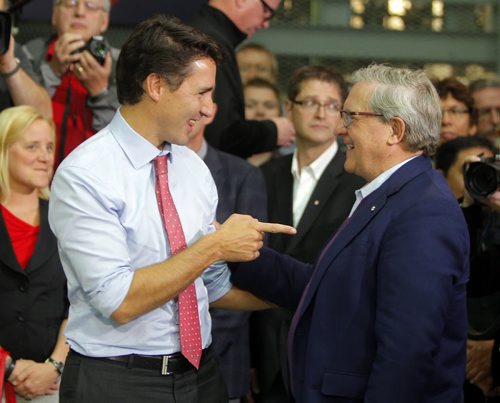 Liberal Party Leader Justin Trudeau at Carte International in Winnipeg on Tuesday. Here he talks to former Liberal cabinet minister Lloyd Axworthy.  BORIS MINKEVICH / WINNIPEG FREE PRESS  Sept. 29, 2015