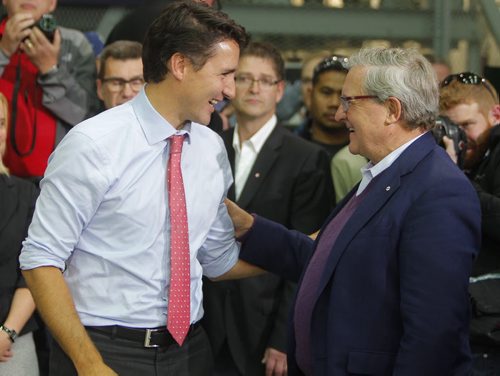 Liberal Party Leader Justin Trudeau at Carte International in Winnipeg on Tuesday. Here he talks to former Liberal cabinet minister Lloyd Axworthy.  BORIS MINKEVICH / WINNIPEG FREE PRESS  Sept. 29, 2015