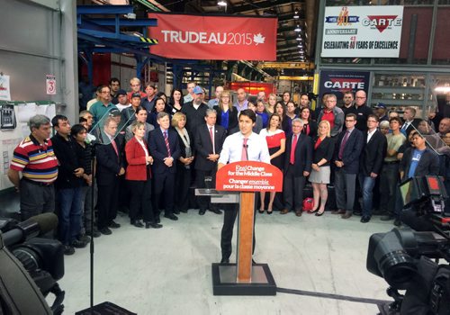 Liberal Party Leader Justin Trudeau (centre) speaks at Carte International in Winnipeg on Tuesday. BORIS MINKEVICH / WINNIPEG FREE PRESS  Sept. 29, 2015