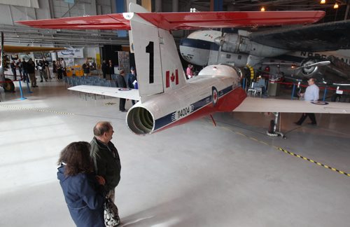 People check out a Snowbird CT-114 Tutor which  was added on display to the Royal Aviation Museum today. It is on loan from The Royal Canadian Air force  This plane sat on a airforce ramp in the weather for 21 years in Winnipeg-The plane originally was used as a mechanical training plane and is the 4th Tutor from the factory- Standup Photo- Sept 29, 2015   (JOE BRYKSA / WINNIPEG FREE PRESS)