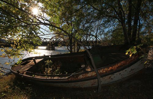 Rusting hulks of "tenders" boats that used to maintain the buoys and navigstional systems on the river lay beside the Higgins Street Bridge.   September 29, 2015 - (PHIL HOSSACK / WINNIPEG FREE PRESS)