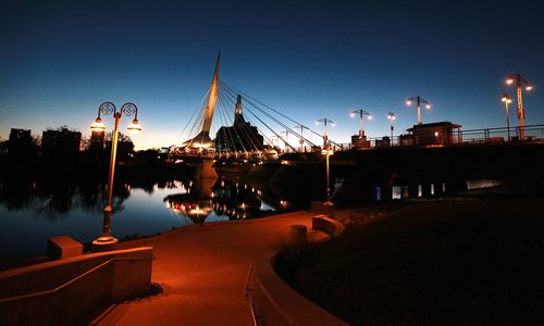 The Esplinade Riel and Provencher Bridge reflect in the Red River at dusk. September 29, 2015 - (PHIL HOSSACK / WINNIPEG FREE PRESS)