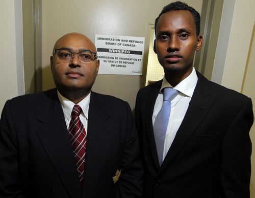(right) Yahya Samatars refugee protection hearing takes place in Winnipeg via teleconference with the IRB official in Toronto. Left is Samatar's lawyer Bashir Kahn. BORIS MINKEVICH / WINNIPEG FREE PRESS  Sept. 30, 2015