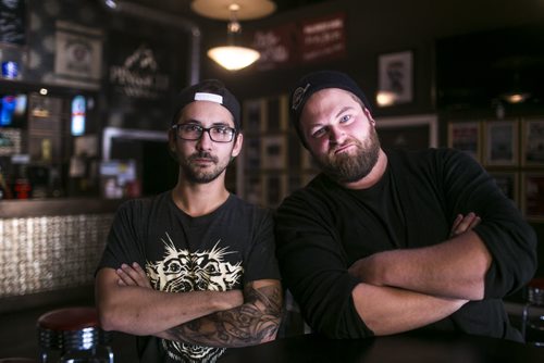 Triggers band members Kyle Monkman, left, and Braden Wilks reminisce about times had in The Park theatre in Winnipeg on Wednesday, Sept. 23, 2015.   Mikaela MacKenzie / Winnipeg Free Press