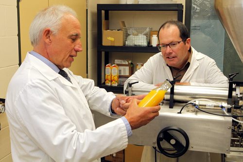 L-R Peter Jones and Tim Hore help put together an upcoming conference in Winnipeg about product packaging. (The Richardson Centre produces and studies foods that can act as medicine). BORIS MINKEVICH / WINNIPEG FREE PRESS  Sept. 30, 2015
