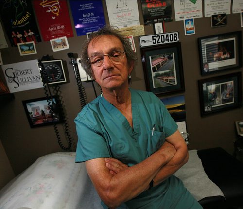 Dr. Gerald Clayden, a surgeon poses in his Carman clinic. He drove to Altona once a week to do surgeries until operations at the hospital stopped. State-of-the art Altona operating room has not done any surgeries since April and does not plan to do any until at least the end of the year because of a shortage of nursing staff. Administrators refuse to hire private nurses to fill the gap. See Larry Kusch story. September 30, 2015 - (PHIL HOSSACK / WINNIPEG FREE PRESS)