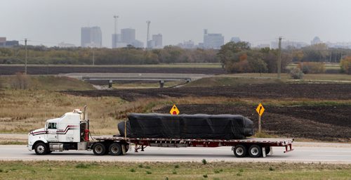 A semi merges from the West Perimeter onto CentrePort Canada Way, Wednesday, September 30, 2015. (TREVOR HAGAN/WINNIPEG FREE PRESS)