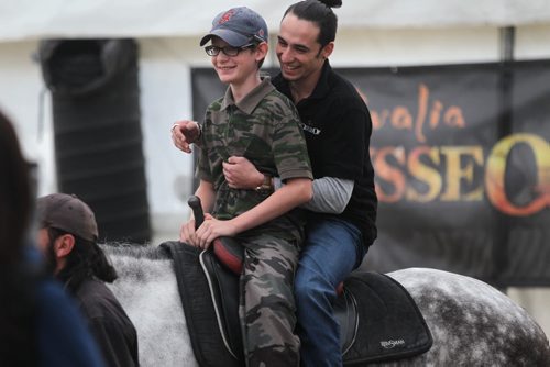 Eleven-year-old Kolin Coulson is all smiles as he rides a horse  while visiting Odysseos equestrian world with other CHILDREN FROM THE CANADIAN NATIONAL INSTITUTE FOR THE BLIND on Thursday afternoon.   See story.   Oct 01, 2015 Ruth Bonneville / Winnipeg Free Press
