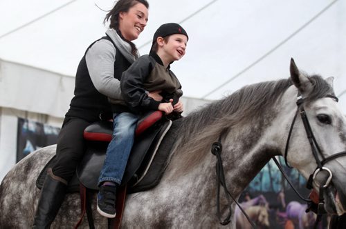 Ashton Francey is all smiles as he rides a horse  while visiting Odysseos equestrian world with other CHILDREN FROM THE CANADIAN NATIONAL INSTITUTE FOR THE BLIND on Thursday afternoon.   See story.   Oct 01, 2015 Ruth Bonneville / Winnipeg Free Press