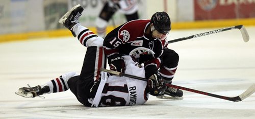 Virden Oil Capitol's #15 Kaiden Jones (top) and Neepawa Native #18 Kyle McDonald  (bottom) work it out Friday afternoon at the IcePlex. See Melissa Martin's story. October 2, 2015 - (PHIL HOSSACK / WINNIPEG FREE PRESS)