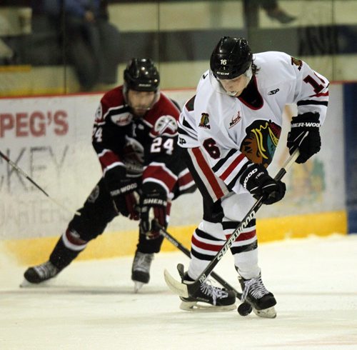 Neepawa Native #16 Austin Ramirez evades Virden's #24 Dylan Cusmano Friday afternoon at the IcePlex. See Melissa Martin's story. October 2, 2015 - (PHIL HOSSACK / WINNIPEG FREE PRESS)