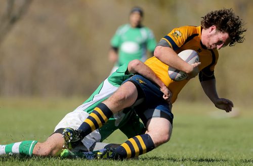 A member of the Winnipeg Saracens, is tackled by a member of the Wanderers during their finals game at Maple Grove Rugby Park, Saturday, October 3, 2015. (TREVOR HAGAN/WINNIPEG FREE PRESS)
