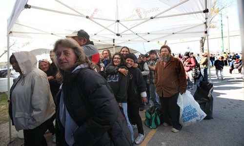 Hundreds of people wait hours in line to browse through clothing and wares at the second annual Wpg Street Store held at the Indian and Metis Friendship Centre Saturday.  The pop-up store that is specifically designed for individuals with low  or no income offering them free clothing and hygiene items was expanded to include bicycle repairs and haircuts.  Standup photo   Oct 03, 2015 Ruth Bonneville / Winnipeg Free Press