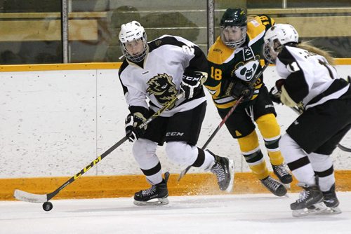 October 4, 2015 - 151004  -  University of Manitoba Bisons' Alanna Sharman (24) skates away from Alberta Pandas' Hannah Olenyk (18) as Bisons' Courtlyn Oswald (11) looks on at the University of Manitoba Sunday, October 4, 2015.  John Woods / Winnipeg Free Press