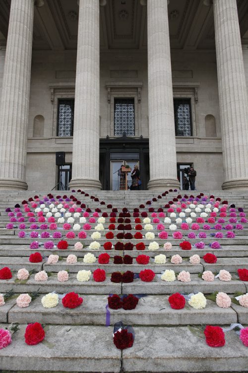October 4, 2015 - 151004  -   A butterfly made of coronations sits on the steps of the Manitoba Legislature as presenters speak at a gathering Sunday, October 4, 2015. The event is part of a  National  Day of Action for Violence Against Indigenous Women and taking place in various cities today. John Woods / Winnipeg Free Press