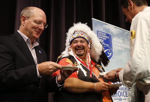 Chief Cameron Catcheway of the Skownan First Nation and Jay Lugar, Director of the Marine Stewardship Council are served pickerel prepared by Chef Thomas Pitt at the announcement that Club Regent Casino and the McPhillips Station Casino will be serving certified sustainable Manitoba harvested pickerel. The event was held Monday at the Club Regent Casino.    Alex Paul story  Wayne Glowacki / Winnipeg Free Press October 5 2015