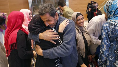 24 Syrians arrived at the  James A Richardson International Airport Monday afternoon and were greeted by family and volunteers. Kamal is hugging relatives after his  arrival. They've been living in a refugee camp for more than a year and were privately sponsored to come to Canada.  Carol Sanders story  Wayne Glowacki / Winnipeg Free Press October 5 2015