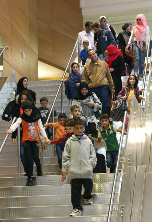 24 Syrians arrive at the James A Richardson International Airport Monday afternoon and were greeted by family and volunteers. They've been living in a refugee camp for more than a year and were privately sponsored to come to Canada.  Carol Sanders story  Wayne Glowacki / Winnipeg Free Press October 5 2015
