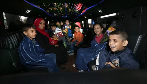 The 24 Syrian refugees got a free ride in a  stretch Hummer thanks to Hollywood Limo Service from James A Richardson International Airport to their accommodations after they arrived Monday afternoon. They've been living in a refugee camp for more than a year and were privately sponsored to come to Canada.  Carol Sanders story  Wayne Glowacki / Winnipeg Free Press October 5 2015