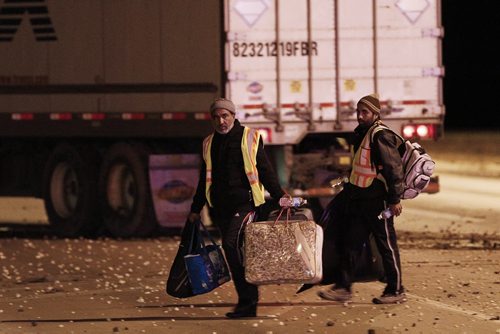 October 5, 2015 - 151005  -  Two men leave a semi as RCMP investigate a semi/minivan collision on the perimeter just north of Dugald Road Monday, October 5. John Woods / Winnipeg Free Press