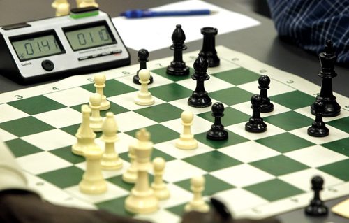 Players go head to head at  Chess Manitoba's weekly tournament at U of W. Timers and chess pieces. BORIS MINKEVICH / WINNIPEG FREE PRESS  OCT 6, 2015
