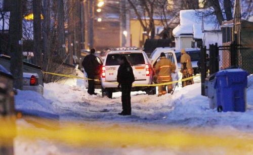 John Woods / Winnipeg Free Press / January 4, 2008- 080104  - Police and fire personnel in the backlane behind 371 Maryland.  Winnipeg police surrounded 371 Maryland after a body was found in the backyard of the home Friday, January 4, 2008.