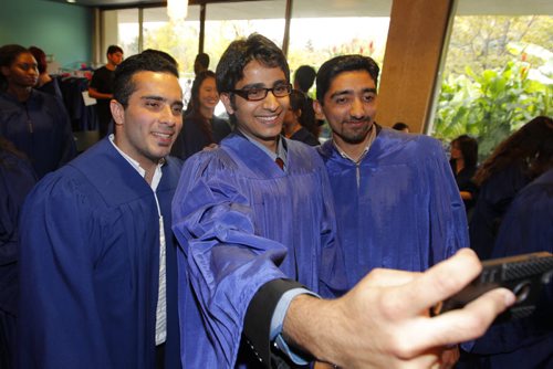 Graduation at the International College of Manitoba. Mehrdad Kadkhodaeimohammadabadi, Muhammad Farooq, and Hassan Abbas do a selfie. BORIS MINKEVICH / WINNIPEG FREE PRESS  OCT 7, 2015