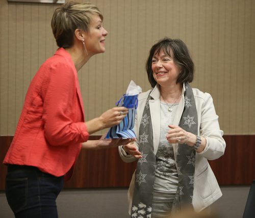 (L-R): Emcee Joanne Kelly and Bookmates chairperson Marilyn McKinnon hand out gifts at Bookmates' fifth annual Breakfast With Bookmates event Oct. 7, 2015 at the Viscount Gort Hotel. Proceeds from the event support Bookmates family literacy programs in communities around the province. Photo by Jason Halstead/Winnipeg Free Press