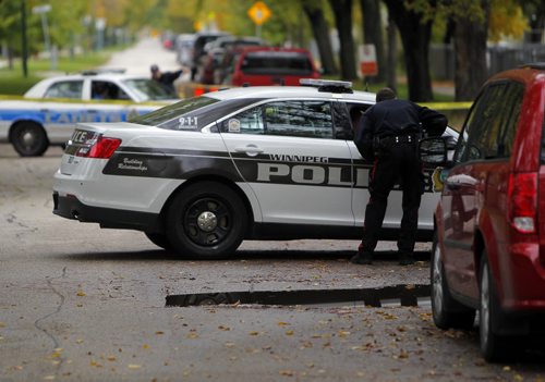 Crime scene in the 400 block of Flora Ave. BORIS MINKEVICH / WINNIPEG FREE PRESS  OCT 8, 2015