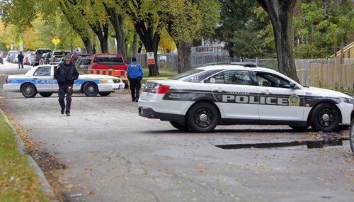 Crime scene in the 400 block of Flora Ave. BORIS MINKEVICH / WINNIPEG FREE PRESS  OCT 8, 2015