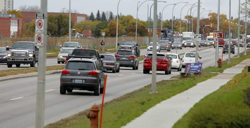 Traffic on Keniston near Kapyong Barracks. BORIS MINKEVICH / WINNIPEG FREE PRESS OCT 8, 2015