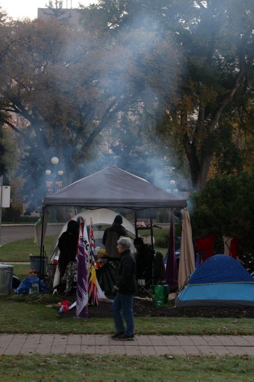 Keeping Warm- Smoke rises from a tent as participants keep warm during Day 09 of the murdered and missing women and girls camp protest outside the Manitoba Legislature  Standup Photo-Oct 09, 2015   (JOE BRYKSA / WINNIPEG FREE PRESS)
