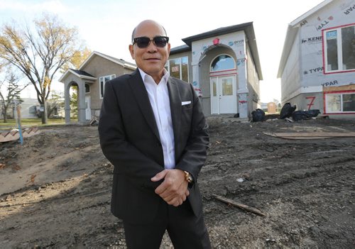 FCP Smart Builder Inc. co-owner Felix Pao shows off new affordable homes the company has under construction on the east side of Fife Street between Church and Machray avenues on Oct. 9, 2015. Theyre all three-bedroom, bi-level homes that are 912 square feet in size and priced at $279,000. Five are under construction and another four will likely be built next year.Photo by Jason Halstead/Winnipeg Free Press RE: McNeill business story