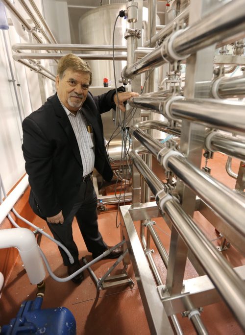Paul Kostas, president and CEO of Santorini Dairies Inc., shows off the pasteurizing system at the companys new cheese factory on Dufferin Avenue in the North End on Oct. 9. Santorini has taken over the former Whiteshell Dairy facility, whose owners went bankrupt last year before the plant could be fully commissioned. The new plant is expected to employ up to 45 workers once its fully operational. Photo by Jason Halstead/Winnipeg Free Press RE: McNeill business story