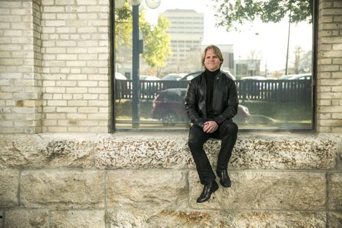 Architect Brent Bellamy poses for portraits outside his office in the Exchange District for The Rivers project  in Winnipeg on Friday, Oct. 9, 2015.  (Mikaela MacKenzie/Winnipeg Free Press)