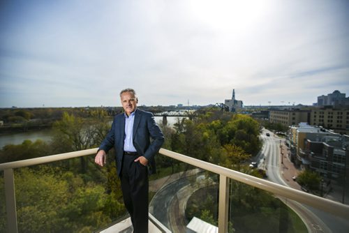 Developer Fausto Pereira poses for portraits on his balcony at The Excelsior, which he developed and now lives in, for The Rivers project  in Winnipeg on Friday, Oct. 9, 2015.  (Mikaela MacKenzie/Winnipeg Free Press)